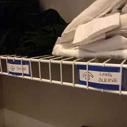 Labelled sections in kids' closet 